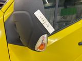 a yellow car that has a sticker on the side of it