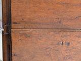 a close up of an old wooden chest of drawers