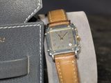a watch that is sitting on top of a watch case