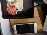 a cell phone sitting in a box on top of a table