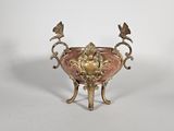 an image of a pink and gold vase with two birds on it
