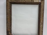 an old wooden picture frame with a glass window on a white surface