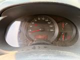 a close up of a dashboard with a speedometer in it