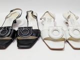 trois paires de chaussures de femmes sont alignées sur une surface blanche