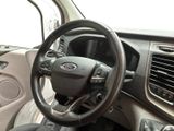 a steering wheel and dashboard of a car in a vehicle