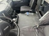 a view of the inside of a bus from the driver ' s seat