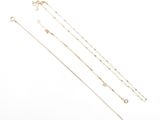 a set of four gold chain necklaces