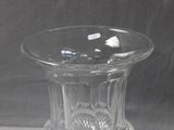 a clear glass vase sitting on top of a table