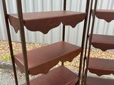 three tiered display shelves with a metal frame and wood top