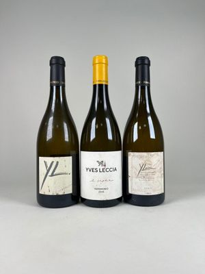 three bottles of wine sitting next to each other on a table
