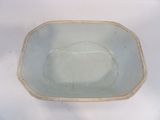 a white bowl with a blue rim sitting on a table