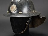 a close up of a fireman ' s helmet on a mannequin head