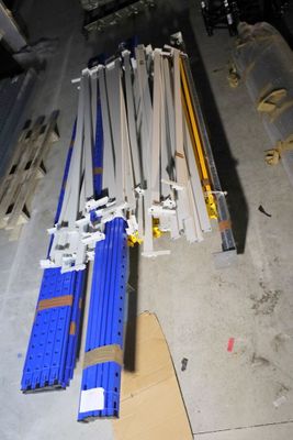 a pile of construction materials on the floor in the garage