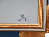 an image of a picture of a gold frame with a picture of a bird