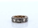 a close up of a ring on a table with a white background
