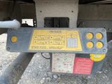 a close up of a yellow and black control panel on a truck