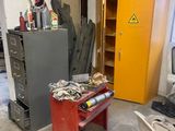 an image of a workbench in a garage with a lot of clutter