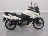 a picture of a white and black motorcycle parked in a room