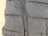 grey down filled jacket with zippers and zippers on it