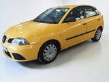 a picture of a yellow car parked in a white room