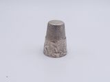 a thimble that is sitting in the snow