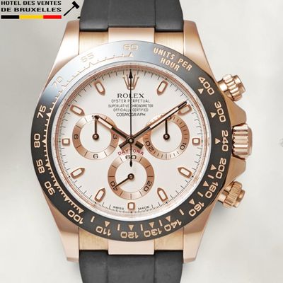 rolex watch with rose gold bezel and black rubber strap