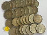 a lot of coins that are on the table