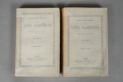 two old books sitting on top of a table next to each other
