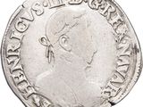 a close up of a coin with a man ' s face on it
