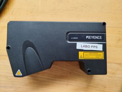 a close up of a keyence on a wooden table
