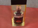 a small bottle of alcohol in a clear box