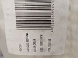 a close up of a bottle of water with a barcode on it