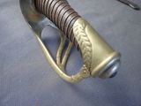 a close up of a knife with a handle on a table