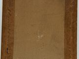 an old picture frame with a piece of brown paper on it