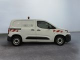 a picture of a white van parked in a room