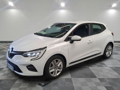the white car is parked on a checkered tile floor