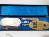 a silverware set in a blue box on a table