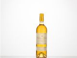 a bottle of white wine sitting on top of a table