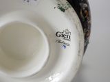 a close up of a vase with a label on it