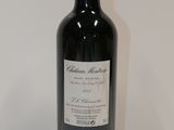 a bottle of wine that is sitting on a table