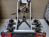 a bike that is attached to the back of a car