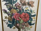 painting of a vase of flowers on a table in a gold frame