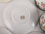 many plates and bowls that are sitting on a table