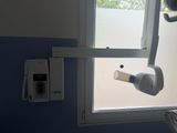 a hair dryer hanging from a window in a bathroom