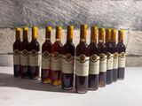bottles of wine lined up in a row on a table