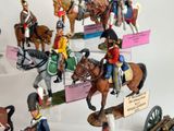 many figurines of soldiers on display on a table