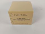 a box of cream on a white surface with a white background