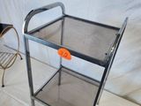 a glass shelf with a chair and a chair on it