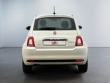 the back end of a white fiat car in a white room