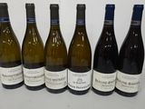 six bottles of wine lined up in a row on a table